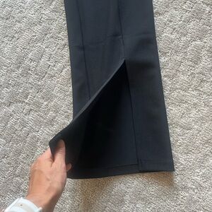 Jumpsuit - xxs - in brand new condition. Side zipper. Front triangle cut out.